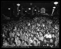 Crowded May Co. department store during Children's Christmas party in Los Angeles, Calif., 1941