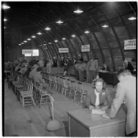 Veterans fill out paperwork to purchase surplus trucks and trailers from the War Assets Administration, Port Hueneme, May 1946