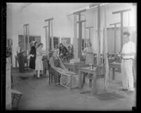 Group of eleven people at California State Workshop for the Blind, making rattan furniture, 1930