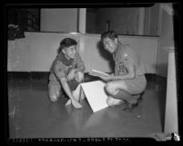 Two Boy Scouts, Joe Takahashi and Toshio Mashimoto working on task in Los Angeles, Calif., circa 1941