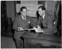 Peter Pianezzi with his lawyer Nathan O. Freedman, at a trial where he is charged with the murders of George (Les) Bruneman and Frank A. Greuzard, Los Angeles, 1940s