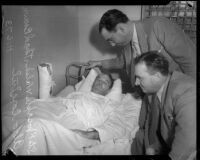 Detectives Aldo Corsini and Thad Brown visit shooting victim Joseph E. Walsh, Los Angeles, 1935