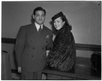 Musician Richard Candreva with his wife Jacqueline in court with a damage suit against actor Victor McLaglen, Los Angeles, March 4, 1940