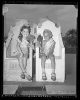 Five-year olds Margaret A. Wall and Bobby Schwartz named King and Queen of wading pool at State Street Playground in Los Angeles, Calif., 1948