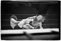 Wrestlers "Daniel Boone" Savage and Hans Steinke battle it out at the Grand Olympic Stadium. June 16, 1937