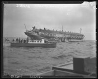 Gambling boat, Rex (larger), resists boarding from California Fish and game Commision boat, Bonita (smaller) off Santa Monica, 1939