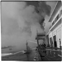 Coast guard and fire fighters working to extinguish the fires that began when the Markay oil tanker exploded in L.A. Harbor, Los Angeles, 1947