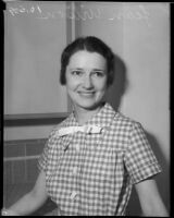 Jean Wilson poses wearing a gingham dress, Los Angeles, 1930s