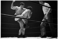 Heavyweight wrestler El Pulpo grappling with an opponent at the Olympic Auditorium, Los Angeles, 1937