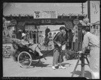 Rickshaw driver and passenger in Chinatown, Los Angeles (Calif.)