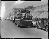 Trucks in the L.A.P.D. parade heading towards the Coliseum, Los Angeles, 1937