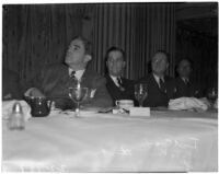 Examiner employees Ted Cook, R. T. Van Ettisch and Lynn Spencer during the Newspaper Day event in the Biltmore Hotel ballroom, Los Angeles, 1940