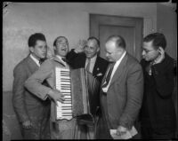 Don Dixon demonstrating his accordion skills to Judge William R. McKay, Los Angeles, 1934