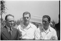 Russian aviators meet the press after breaking the non-stop flight record, flying from Moscow to San Jacinto, CA. July 14, 1937