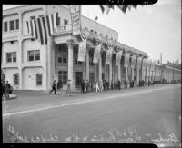 Craft workers on strike stand outside Metro-Goldwyn-Mayer Studios, Culver City, 1937