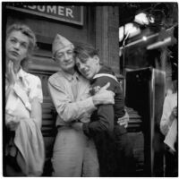 Showing emotions during a celebration of Japan's surrender during World War II, Los Angeles, August 15 and 16, 1945