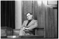 Ambulance driver Harry T. Meredith on the witness stand during the murder trial of Paul A. Wright, Los Angeles, 1938