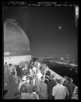 Crowd watching eclipse of the moon on balcony of Griffith Observatory, Calif., 1949