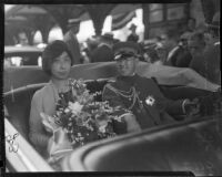 Prince and Princess Kaya of Japan ride in a vehicle through a crowd, Los Angeles, 1934