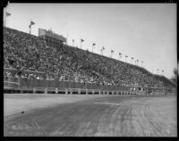 Crowd watching at the Legion Ascot Speedway as Bob Swanson and Rex Mays race, Los Angeles, 1935