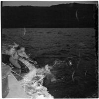 Military personnel practice a water rescue during the Army-Navy maneuvers that took place off the coast of Southern California in late 1946