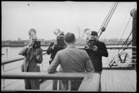 Photographers taking pictures of a passenger on the S.S. Mariposa, Los Angeles