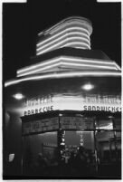 Waitress outside a drive-in restaurant, Los Angeles