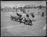 UCLA football team practices their formation on Spaulding Field, Los Angeles, 1930s