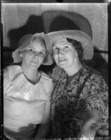 Mrs. L.E. Oates and Mrs. Charles Laraway don sun bonnets for a charity event, Los Angeles, 1935