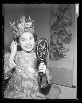 Mrs. Robert Lee dressed in traditional Chinese clothing for Chinese American fashion show, Calif., 1950