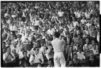 Crowd watches a football match bewteen the Loyola Marymount Lions and the the Santa Clara Broncos, Los Angeles, 1937