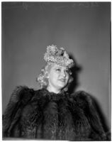 Mae West in court during questioning about earnings from her role in the movie "She Done Him Wrong," Los Angeles, 1940