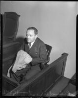 Director Roland West testifying at grand jury investigation into death of actress Thelma Todd, circa 1935