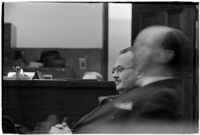 Police Captain Earle E. Kynette sits in court after being charged with conspiracy to commit murder, Los Angeles, 1938