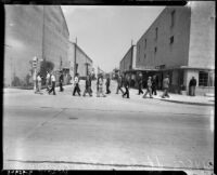 Craft workers on strike stand outside a major motion picture studio, Los Angeles, 1937