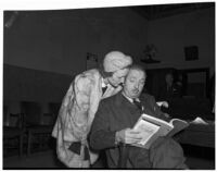 Dr. George K. Dazey and his third wife, Dorcas Dazey, at the trial where Dr. Dazey is accused of the murder of his second wife, Doris S. Dazey, Los Angeles, 1939-1940