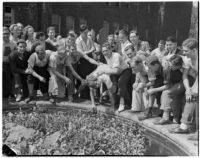 Student being pushed into a fountain during initiation at Los Angeles Junior College, Los Angeles