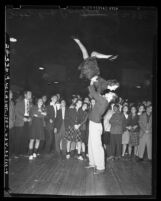 Crowd watching a couple dance in Jitterbug Dance contest Los Angeles, Calif, 1939