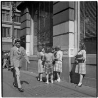 Woman talking to a group of truant girls in downtown Los Angeles, March 1946