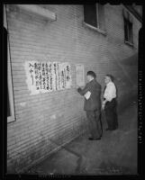 Reading reports of the Pearl Harbor attacks in Little Tokyo, Los Angeles, 1941