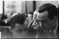 Accused murderer Paul A. Wright conferring with an attorney in court, Los Angeles, 1938