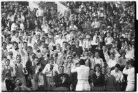 Crowd watches a football match bewteen the Loyola Marymount Lions and the the Santa Clara Broncos, Los Angeles, 1937