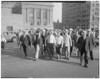 William F. Gettle's kidnappers leave the L.A. County courthouse after being charged with the crime of extortion through the mails. May 28, 1934