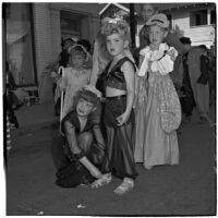 Sally and Sue Newland with other children in costume for Anaheim's annual Halloween festival, Anaheim, October 31, 1946