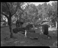 Officials survey a crack that would become a landslide in Elysian Park, Los Angeles, November 1937