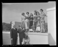 Jimmy McHugh and Russell Havenstrite judging Queen of Mexican Polo contestants at Beverly Hills Polo Club, Beverly Hills, 1950