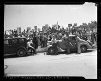 Placard carrying UCLA students during anti-war demonstration in Los Angeles, Calif., 1940