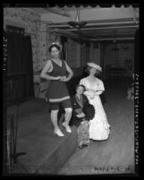 Three women posing in costumes during the Woman's Club Institute of Religious Science pageant; "Cavalcade of American Women," 1947