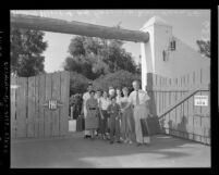 Horace Heidt with members of his "The American Way" troupe at gate of Double HH Ranch in Calif., 1954