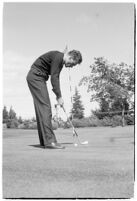 LA Daily News city editor Charles Judson demonstrates improper golf swings for a tutorial series with golfer Fay Coleman. Circa 1940